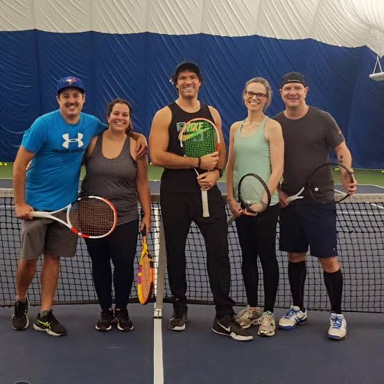 adults taking tennis lessons adults taking tennis lessons