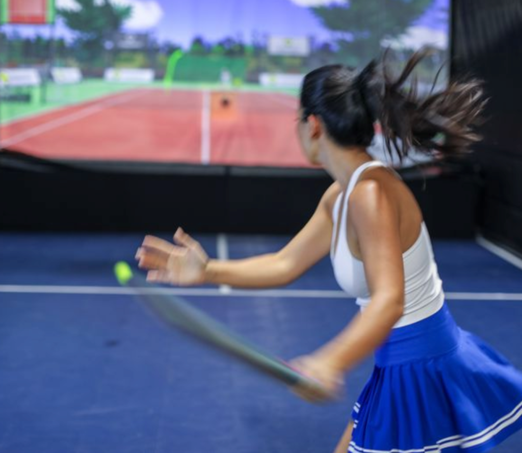 playing on tennis simulator playing on tennis simulator